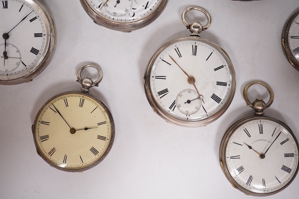 Three early to mid 20th century silver open faced pocket watches, with Roman or Arabic dials and subsidiary seconds, including two keyless and one key wind (Admiral Tacy Watch Co), together with one smaller silver open f